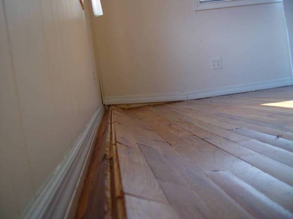 Better angle to see the warping of the oak floor from water damage