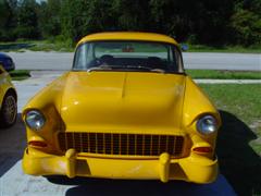 1955 Chevy, 2 door post, with a 1972 corvette engine, yellow exterior paint