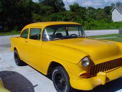 1955 Chevy, 2 door post, with a 1972 corvette engine, yellow exterior paint