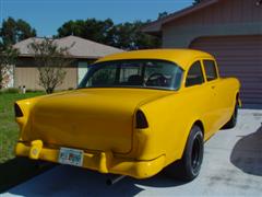 1955 Chevy, 2 door post, with a 1972 corvette engine, yellow exterior paint