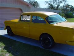 1955 Chevy, 2 door post, with a 1972 corvette engine, yellow exterior paint