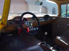 1955 Chevy, 2 door post, with a 1972 corvette engine, yellow exterior paint